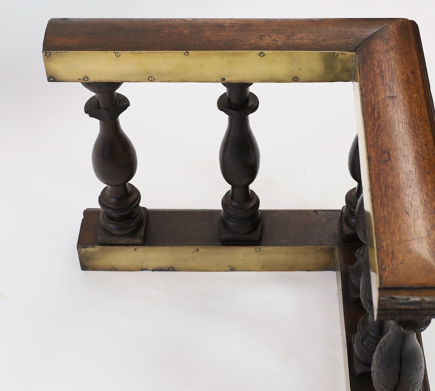 A 19th century brass mounted oak club fender, width 182cm depth 69cm height 58cm